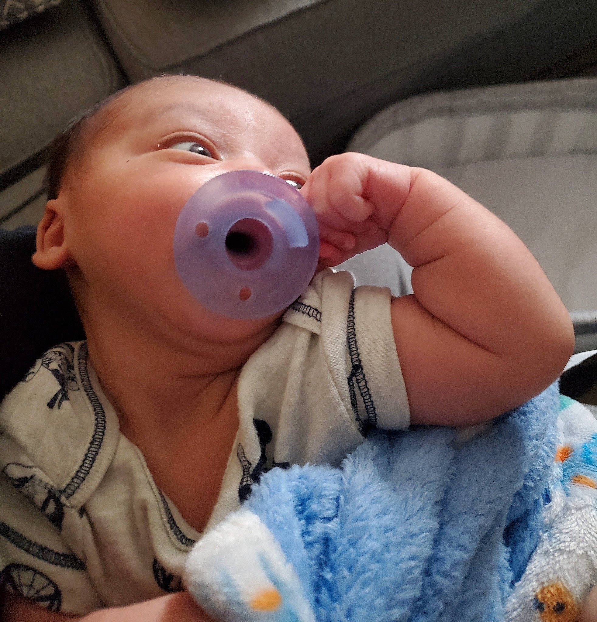 Nehemiah is registered to the contest to win money with this photo: baby, baby_bottle, baby_toddler_clothing, cheek, drinkware, ear, eyebrow, eyelash, finger, gesture, happy, iris, jaw, lip, mouth, neck, nose, person, plastic_bottle, skin