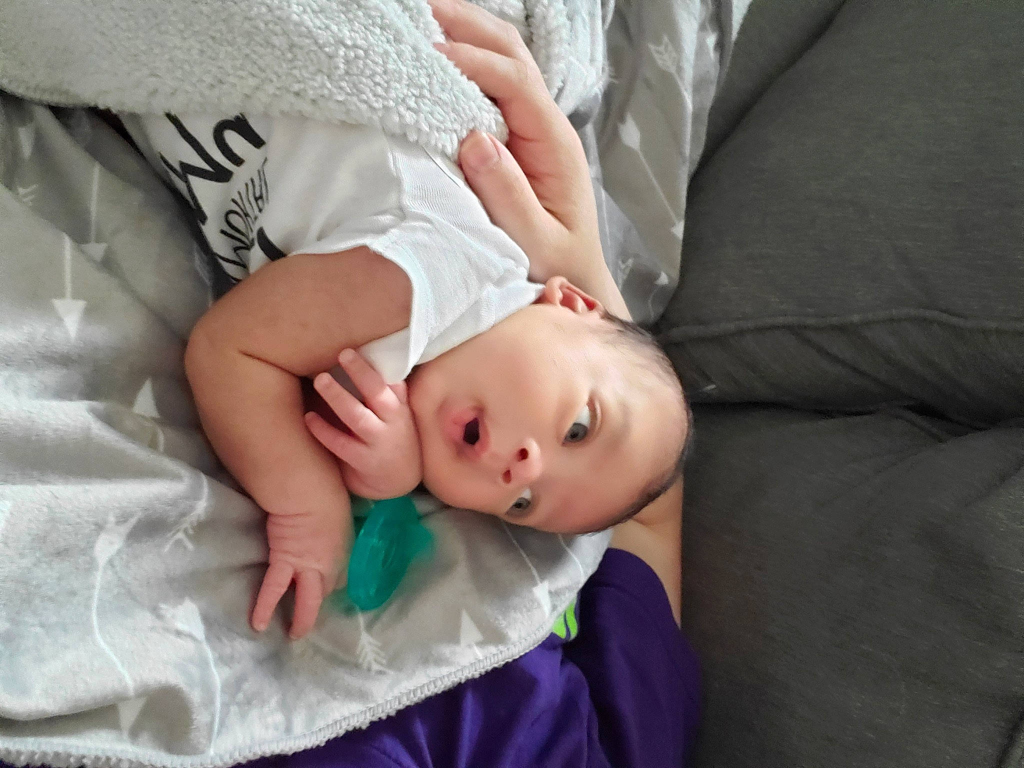 Nehemiah is registered to the contest to win money with this photo: baby, child, comfort, couch, dress, elbow, eye, eyelash, flash_photography, gesture, glasses, grey, linens, pattern, person, plant, sitting, skin, toddler, tree