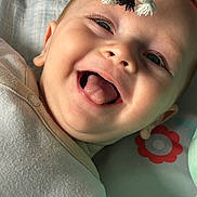 Jackson joined the competition — help win amazing prizes! baby, smiling, tongue_out, play_mat, toy, infant, happy, close_up, face, child, cute, expression, lying_down, clothing, indoors, colorful, playtime, soft_toy, head, skin