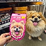 accessory, animal, cute, dog, floor, fluffy, friendly, hand, happy, indoor, package, pet_jewelry, pet_store, price_tag, product, retail, shelf, smiling, tongue_out, toy