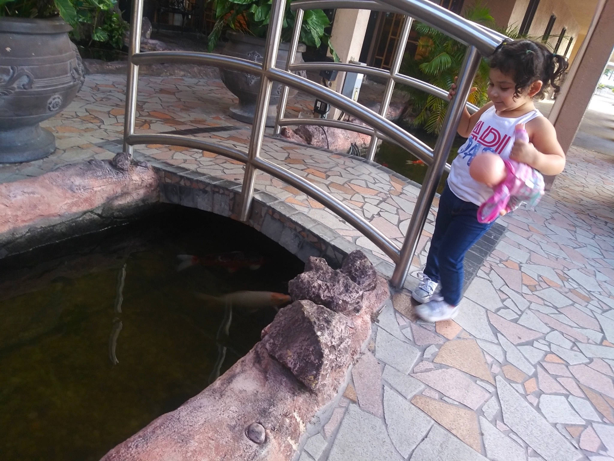 Sariah joined the competition — help win amazing prizes! backyard, child, fun, leisure, person, plant, play, pond, rock, toddler, tree, vacation, water, water_feature, water_resources