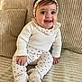 baby, child, clothing, couch, cozy, cute, fabric, happy, headband, indoor, infant, person, portrait, red_hearts, sitting, smiling, sock, texture, white, young