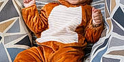 Dhriti joined the competition — help win amazing prizes! baby, child, couch, cozy, cute, fabric, footwear, happy, headgear, indoors, infant, lion_costume, pattern, person, pillow, plush, portrait, sitting, smile, soft