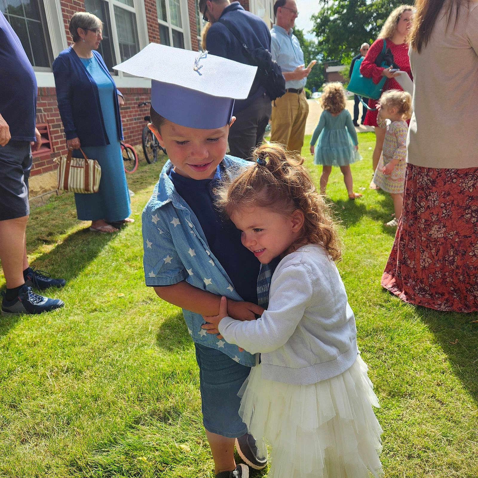 Kiara is registered to the contest to win money with this photo: adult, backyard, clothing, dress, face, female, graduation, grass, head, nature, outdoors, pants, people, person, photography, plant, portrait, skirt, woman, yard