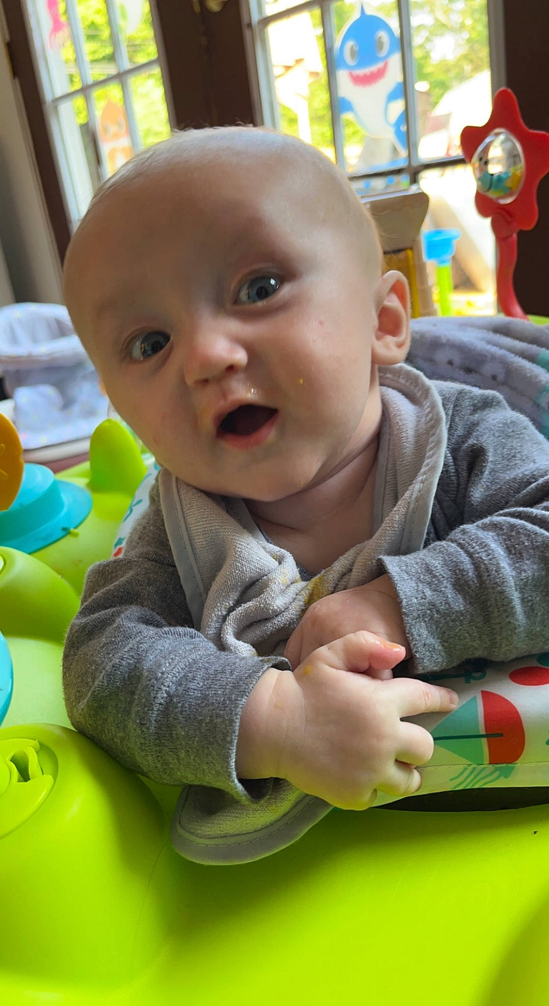 Karson is registered to the contest to win money with this photo: baby, baby_playing_with_toys, baby_toddler_clothing, cheek, child, eye, facial_expression, flooring, fun, grass, happy, head, leisure, people, person, product, sitting, skin, snapshot, toddler