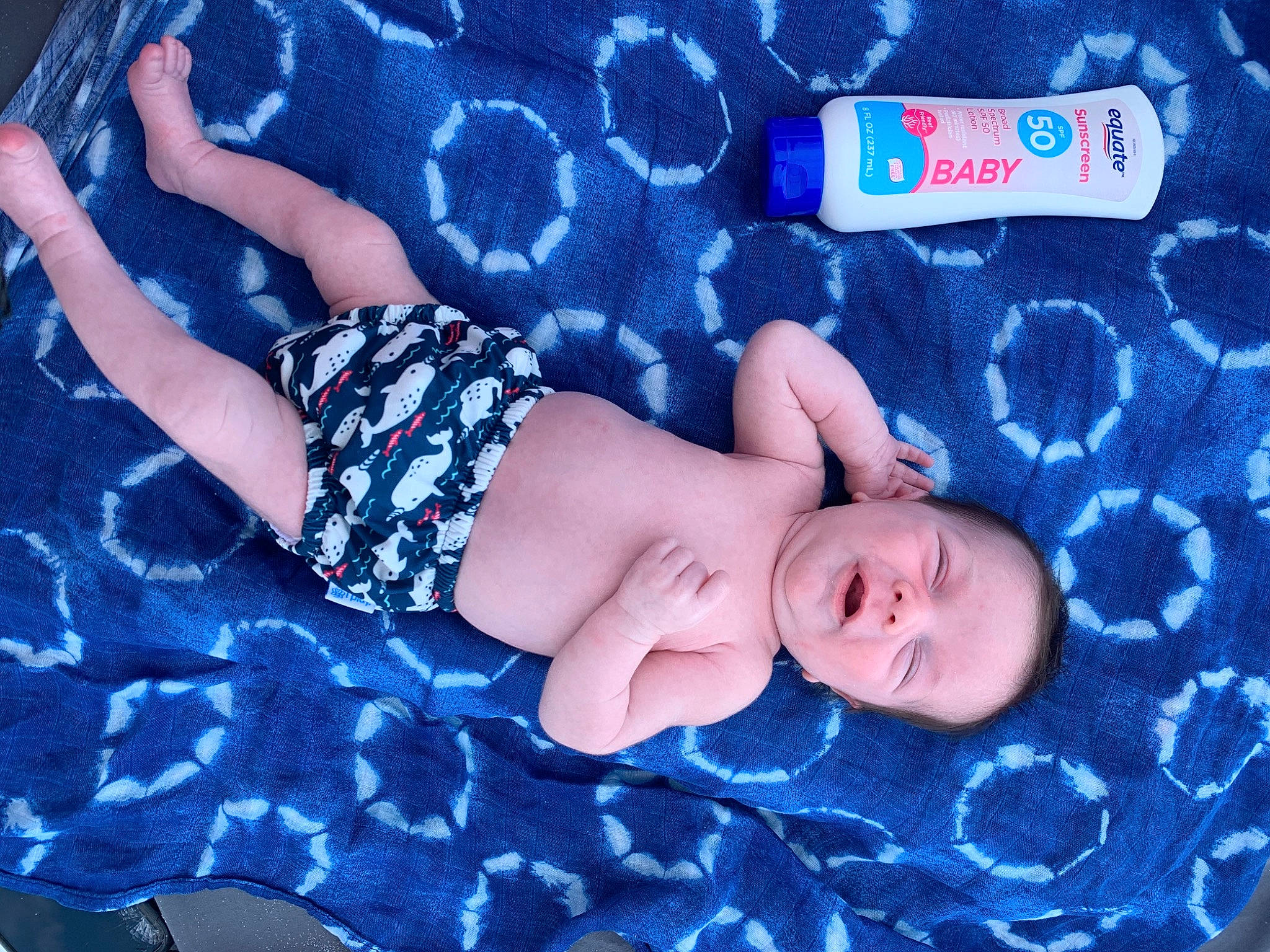 Kolton is registered to the contest to win money with this photo: arm, azure, baby, baby_toddler_clothing, blue, comfort, electric_blue, finger, human_body, leg, nail, pattern, person, product, red, skin, sleeve, thigh, thumb, toddler