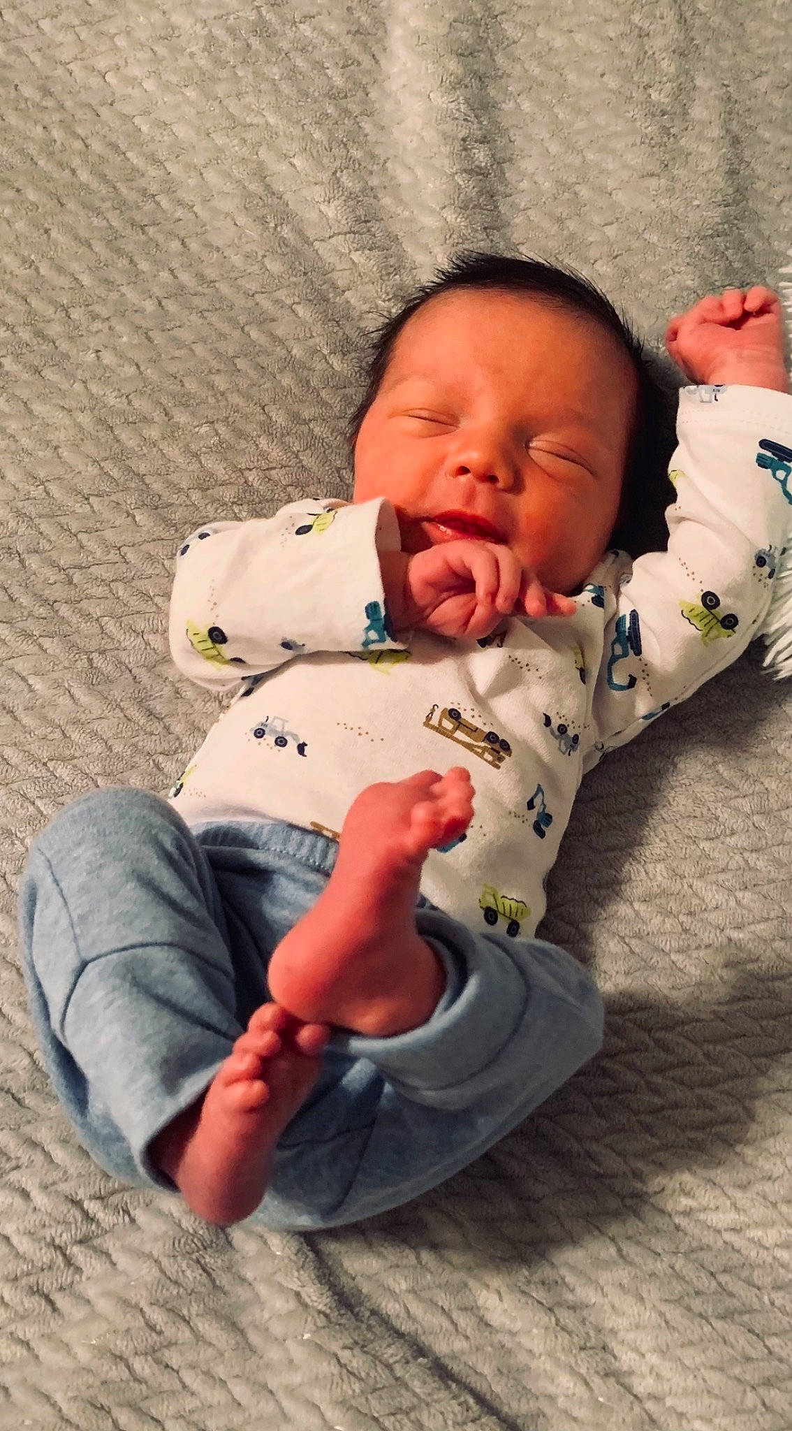 Kolton is registered to the contest to win money with this photo: arm, baby, baby_toddler_clothing, cheek, child, chin, comfort, eye, face, finger, flooring, happy, head, mammal, mouth, nose, person, sitting, skin, sleeve