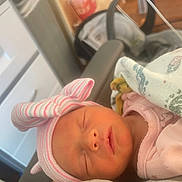 Faith joined the competition — help win amazing prizes! newborn, baby, sleeping, hat, pink, blanket, indoors, face, peaceful, cozy, infant, clothing, resting, cute, child, portrait, headwear, soft_light, wrapped, young