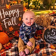 Corey is registered to the contest to win money with this photo: baby, child, infant, five_months, smiling, happy, portrait, autumn, fall, pumpkins, leaves, hay_bale, plaid_blanket, rustic, outdoor, seasonal, chalkboard, milestone, sitting, barefoot