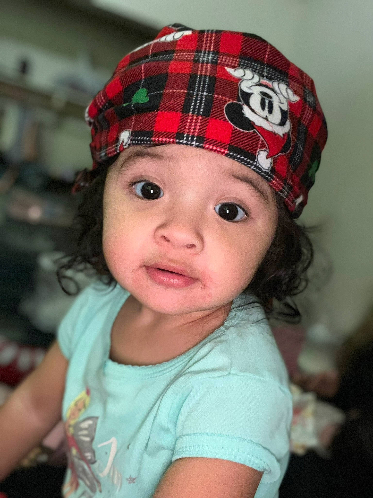 Ava is registered to the contest to win money with this photo: baby, baby_toddler_clothing, cap, costume_hat, eyelash, fashion_accessory, hair_accessory, happy, hat, headgear, headwear, helmet, holiday, knit_cap, lip, pattern, person, plaid, sleeve, t_shirt