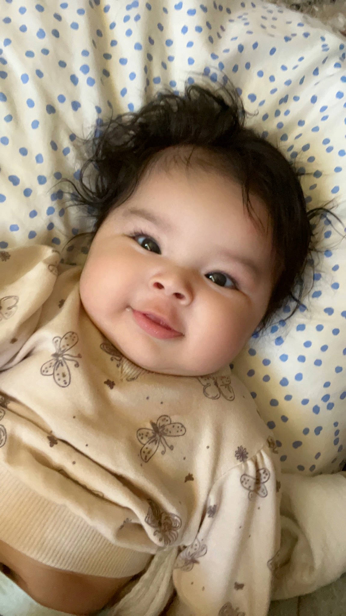 Amayah is registered to the contest to win money with this photo: baby, cheek, chin, eye, eyebrow, face, facial_expression, hair, hairstyle, head, human, iris, lip, nose, organ, person, product, skin, sleeve, smile