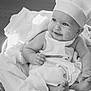 baby, infant, child, chef_hat, costume, smile, face, hands, feet, blanket, cloth, bowl, cooking, flour, cute, portrait, indoors, black_and_white, happy, playful