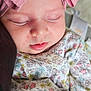 baby, bow, child, closeup, clothing, cute, face, floral, headband, indoors, infant, newborn, peaceful, person, pink, portrait, resting, sleeping, soft, toddler