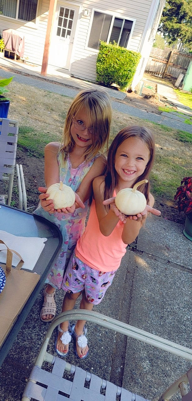 Amber is registered to the contest to win money with this photo: event, food, footwear, fun, grass, happy, human_leg, joy, leg, leisure, person, pink, plant, recreation, sandal, shoe, shorts, skin, smile, tableware