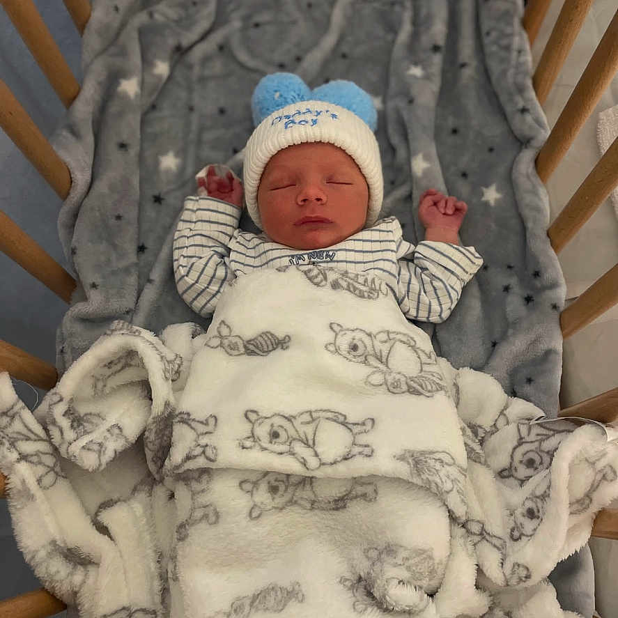 Marley-Jay is registered to the contest to win money with this photo: baby, blanket, child, clothing, cozy, crib, cute, hat, indoors, infant, newborn, pattern, peaceful, resting, sleep, sleeping, soft, teddy_bear, warm, wooden