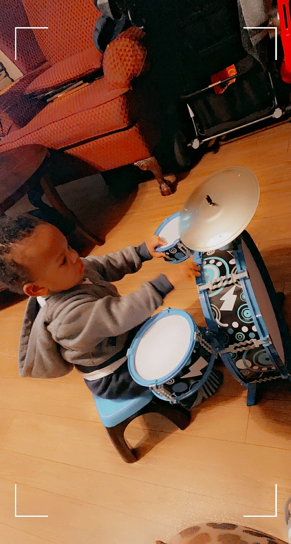 Atlan is registered to the contest to win money with this photo: audio_equipment, bass_drum, chair, drum, drum_stick, drumhead, hand_drum, hat, helmet, human_leg, idiophone, membranophone, musical_instrument, musician, percussion, percussionist, person, personal_protective_equipment, sports_gear, thigh