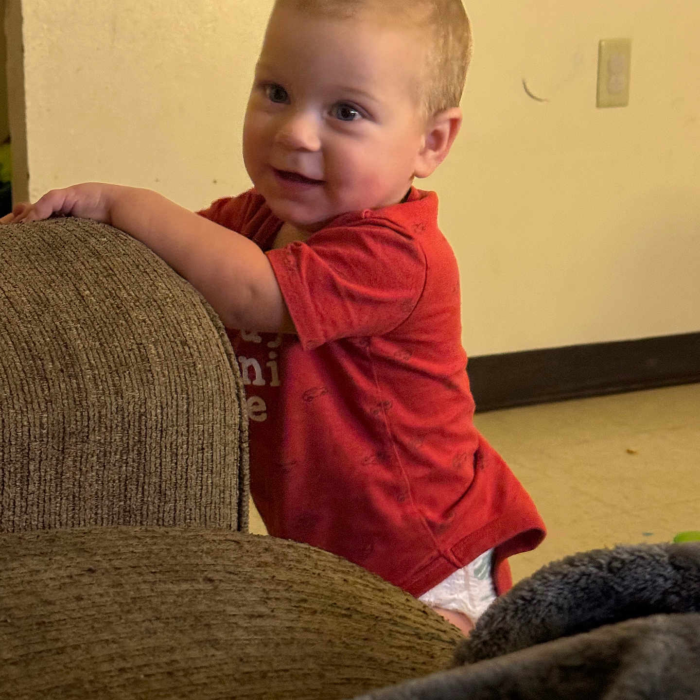 Brayden is registered to the contest to win money with this photo: armchair, baby, bodypart, boy, chair, child, clothing, couch, face, finger, furniture, hand, head, homedecor, male, pants, person, photography, portrait, sitting