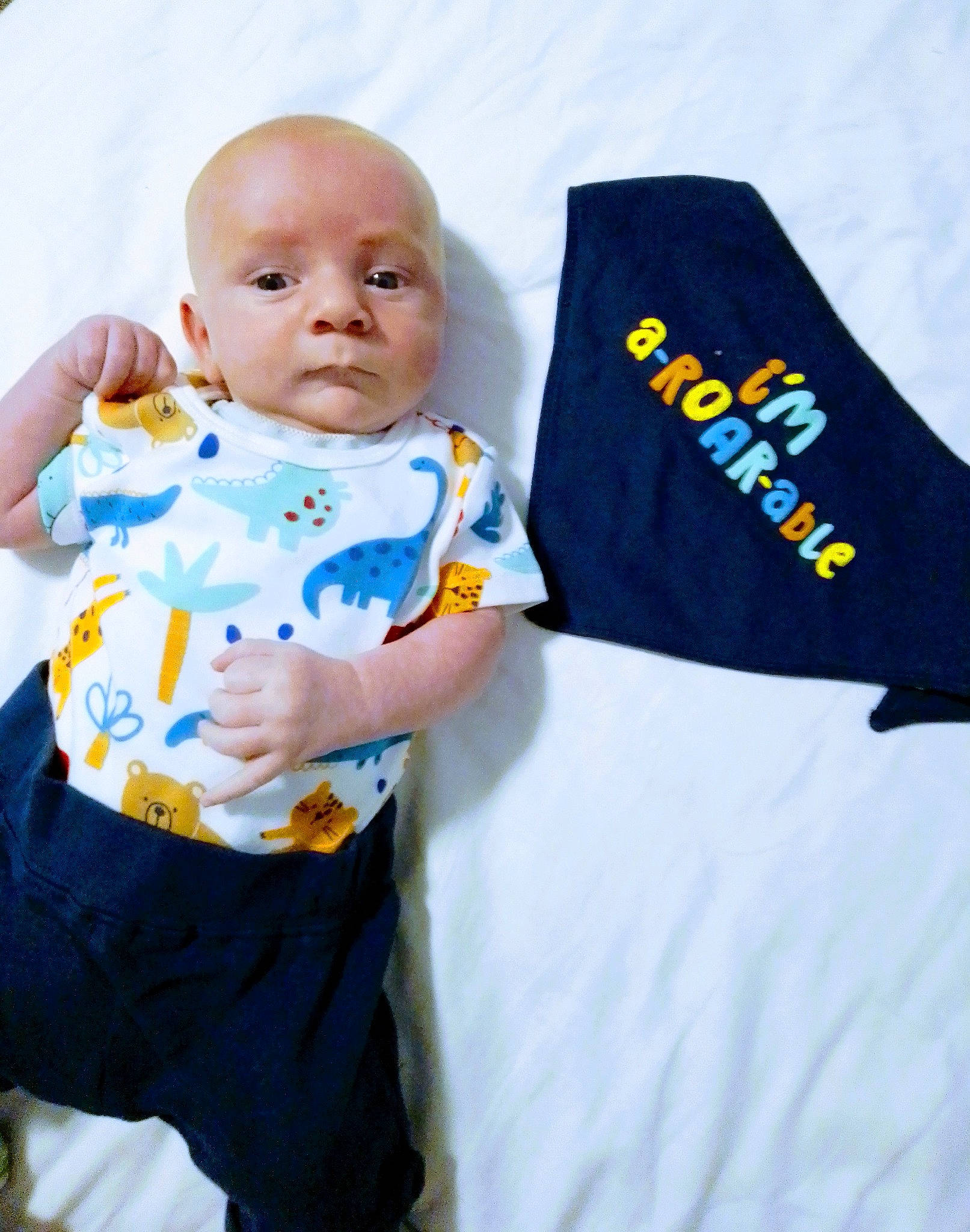 Kaden-james is registered to the contest to win money with this photo: baby, baby_products, baby_toddler_clothing, child, electric_blue, happy, linens, logo, outerwear, pattern, person, portrait_photography, product, sleeve, sportswear, t_shirt, toddler, uniform