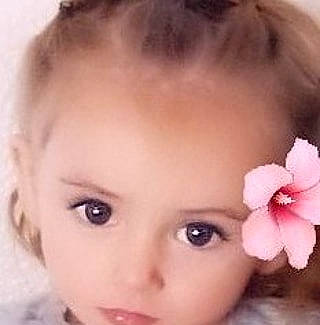 Sandra joined the competition — help win amazing prizes! black_hair, cheek, chin, ear, eyebrow, eyelash, flower, forehead, happy, head, iris, jaw, lip, neck, no_expression, nose, person, petal, plant, skin