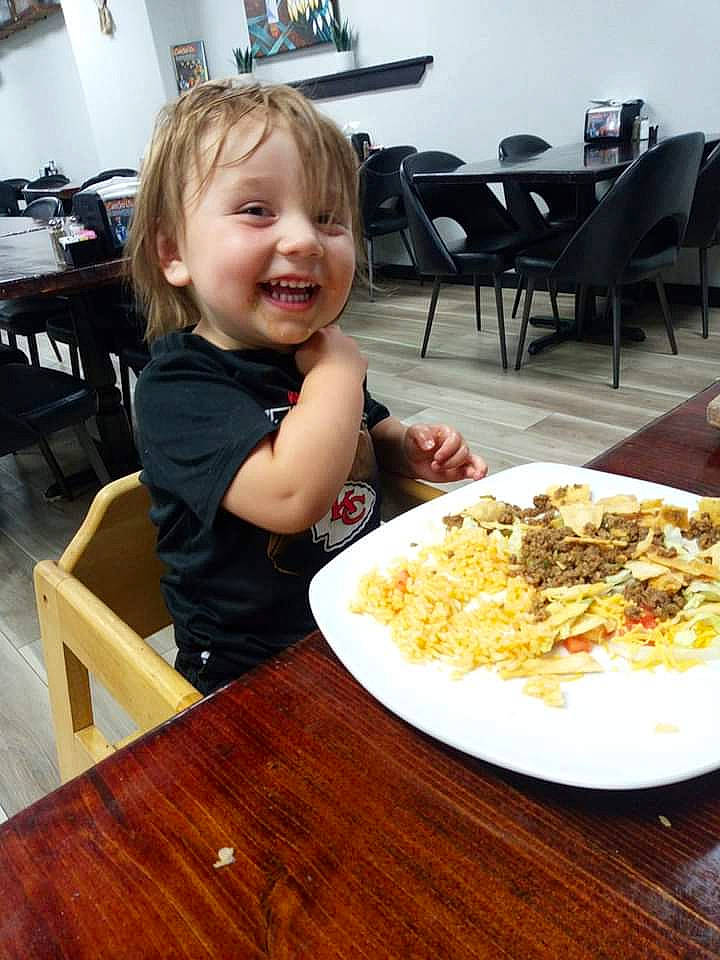 Liam joined the competition — help win amazing prizes! chair, comfort_food, cuisine, desk, dish, event, flooring, food, furniture, hardwood, ingredient, joy, junk_food, person, plate, recipe, smile, table, tableware, toddler