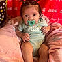 baby, infant, pacifier, pigtails, onesie, blanket, pink, red_background, cute, sitting, child, soft, cozy, indoors, portrait, young_child, face, expression, clothing, person