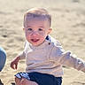 baby, child, beach, sand, sitting, sweater, shorts, barefoot, sunlight, smiling, playful, portrait, outdoor, nature, young, cute, happy, skin, face, person