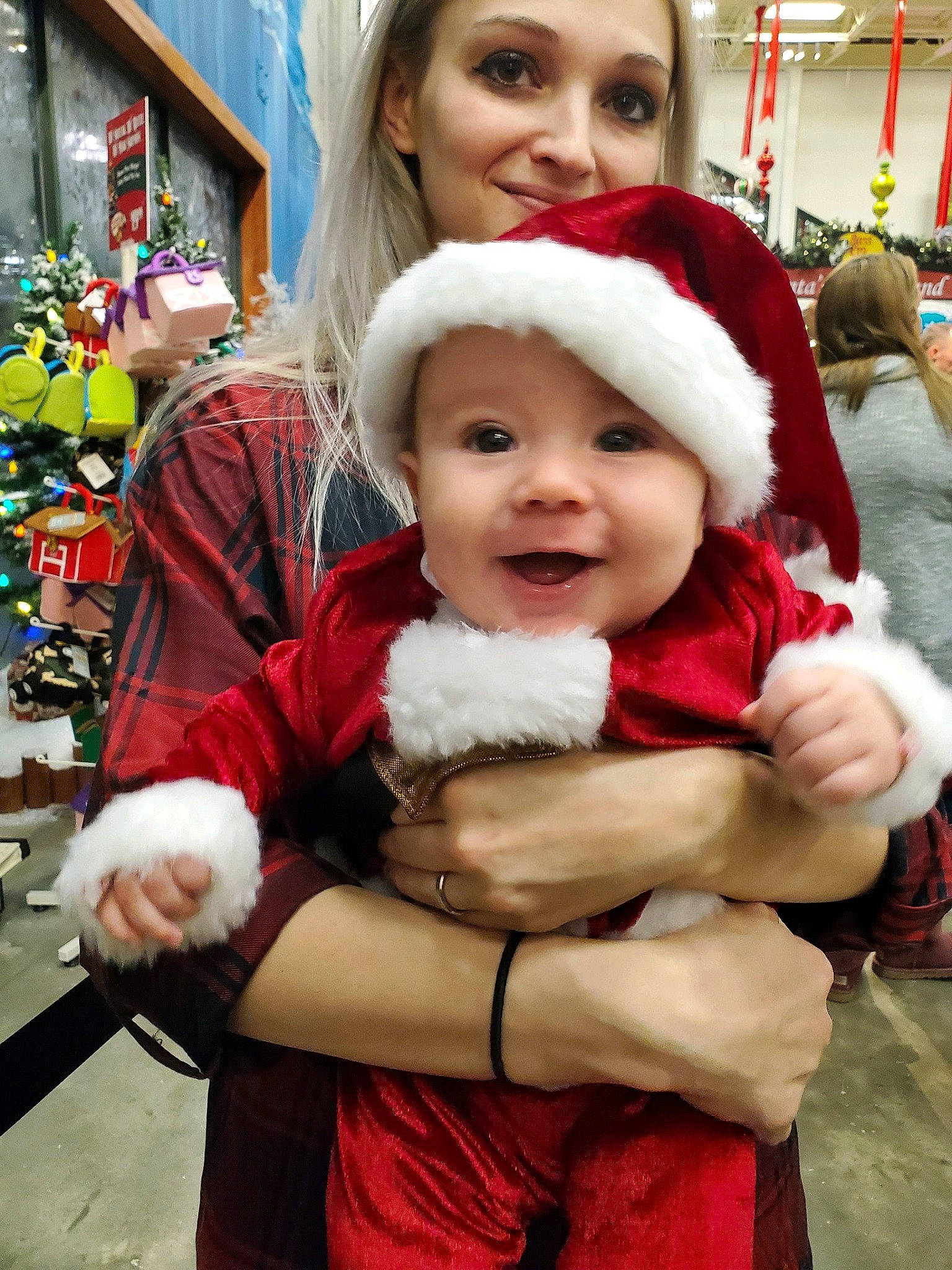 Hayden is registered to the contest to win money with this photo: child, christmas, christmas_eve, costume, fictional_character, fur, happy, headwear, holiday, joy, person, santa_claus, smile, toddler
