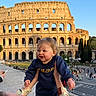 toddler, child, adult, colosseum, rome, landmark, ancient, historical, outdoor, daylight, sky, architecture, tourist, happy, smiling, holding, street, people, building, travel