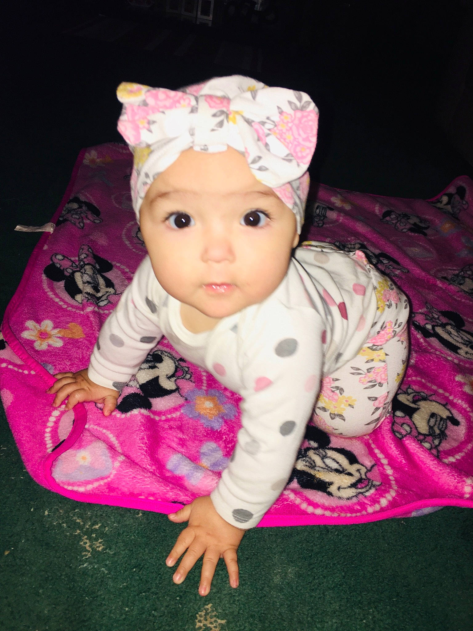 Heavenly is registered to the contest to win money with this photo: baby, baby_toddler_clothing, cheek, child, eye, fashion_accessory, flooring, fun, grass, headband, headpiece, headwear, magenta, pattern, person, pink, purple, sitting, sleeve, textile