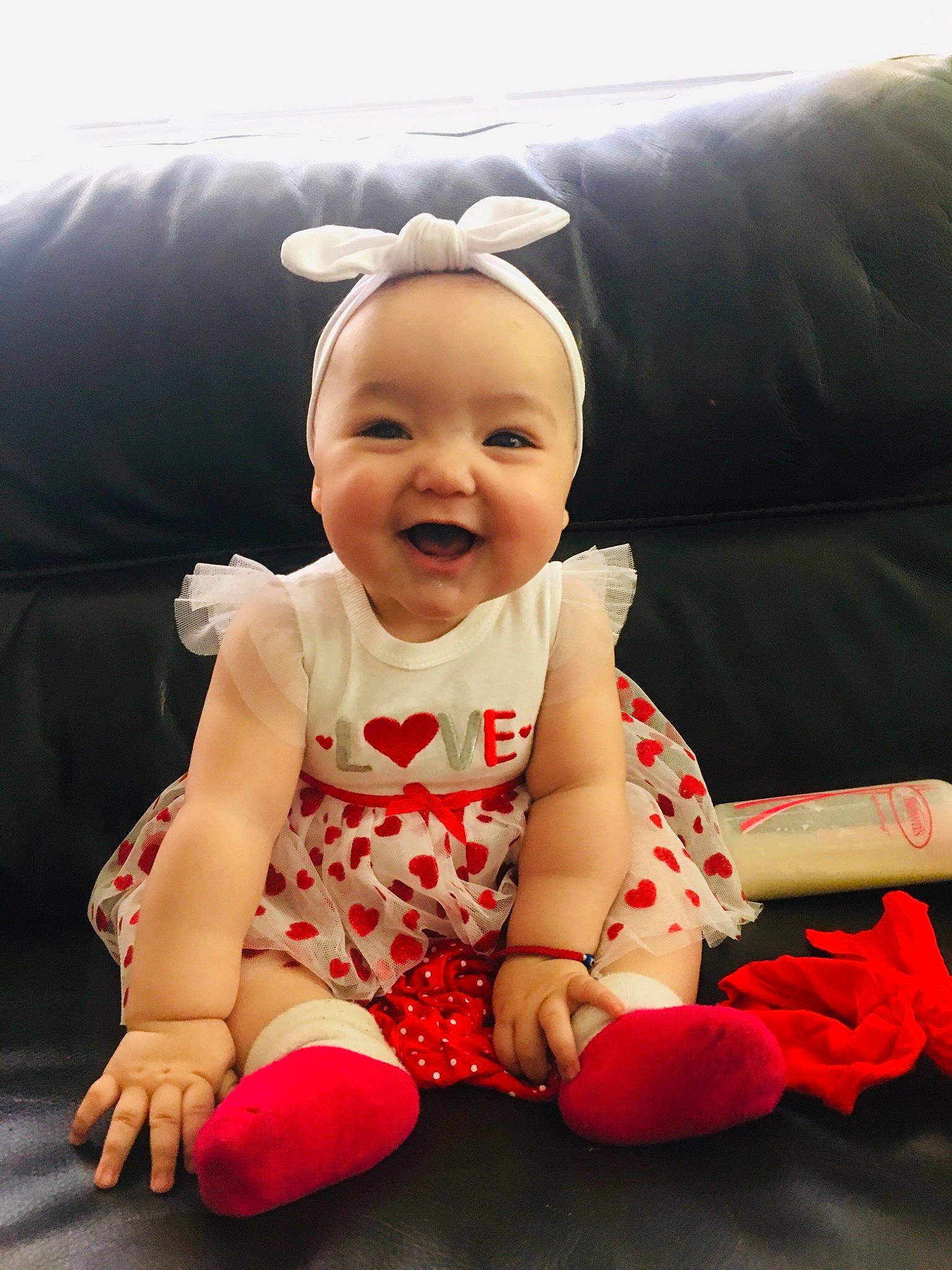 Heavenly is registered to the contest to win money with this photo: baby, baby_toddler_clothing, carmine, child, comfort, couch, face, flash_photography, fun, happy, human_leg, joy, lap, pattern, person, sitting, skin, sleeve, smile, t_shirt