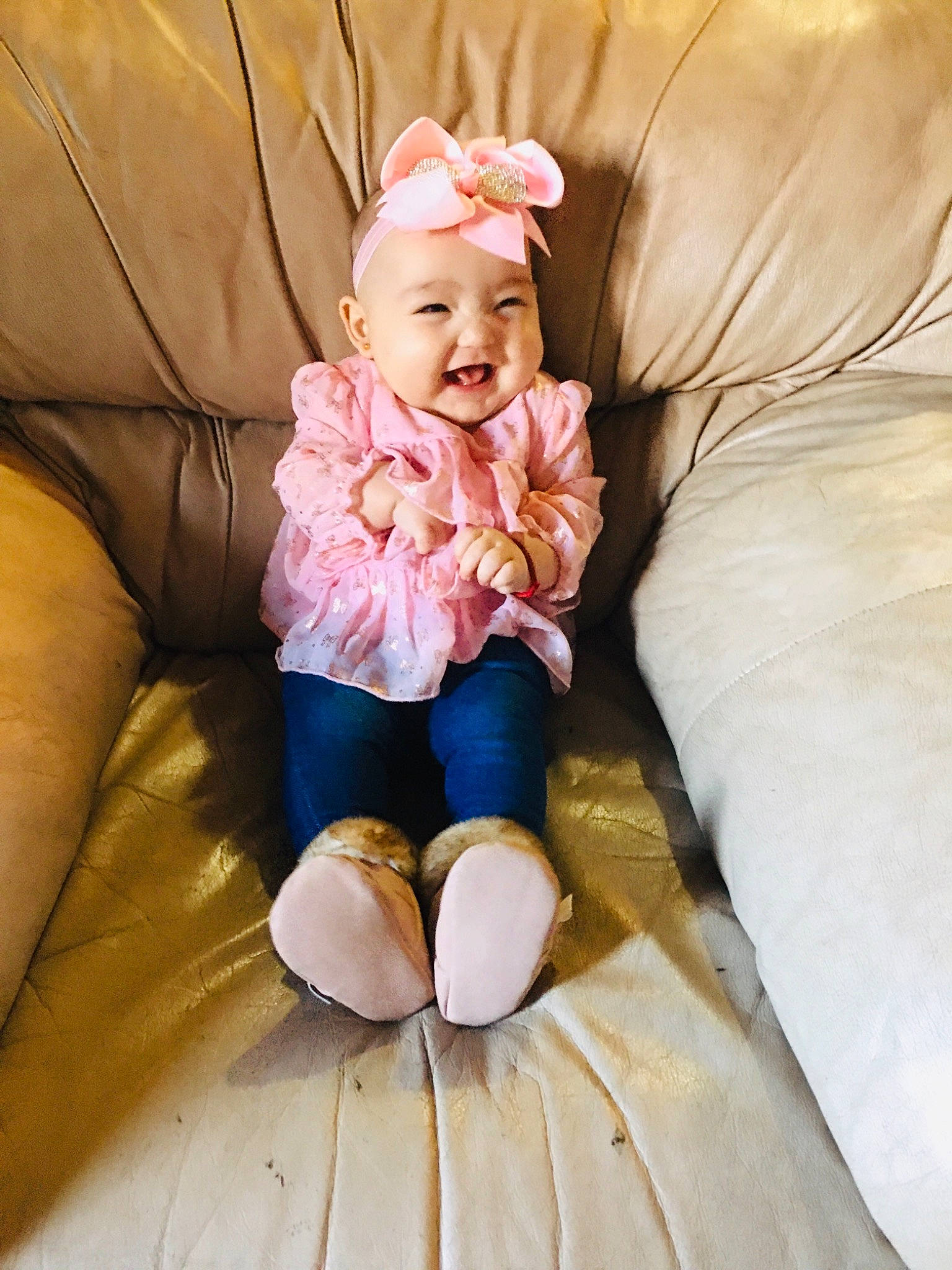 Heavenly is registered to the contest to win money with this photo: baby, baby_toddler_clothing, child, comfort, couch, eye, face, finger, happy, hat, head, headwear, knee, leg, person, skin, sleeve, smile, sneakers, textile