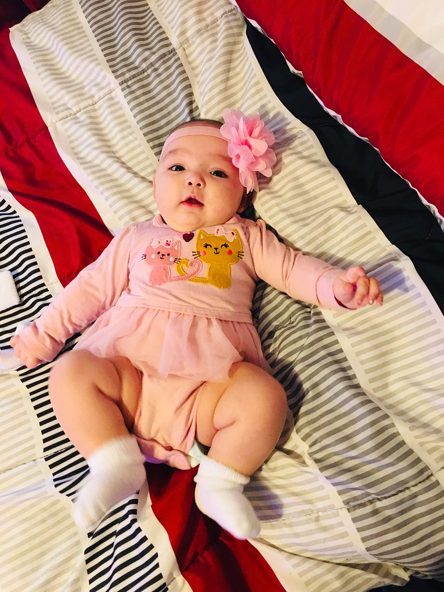 Heavenly is registered to the contest to win money with this photo: baby, baby_carriage, baby_toddler_clothing, chair, child, comfort, couch, eye, face, finger, hand, headwear, lap, leg, person, pink, skin, sleeve, sock, textile