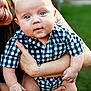baby, child, blue_eyes, checkered_shirt, holding, adult, smile, outdoor, green_background, person, closeup, portrait, skin, hands, face, cute, infant, casual_clothing, summer, happy