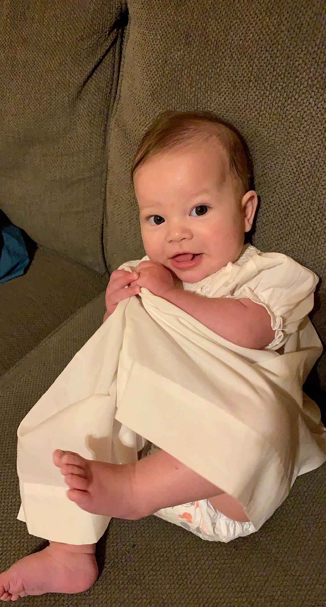 Kinlee is registered to the contest to win money with this photo: baby, baby_products, baby_toddler_clothing, blond, cheek, child, comfort, day_dress, ear, finger, hand, linens, person, pink, skin, textile, toddler