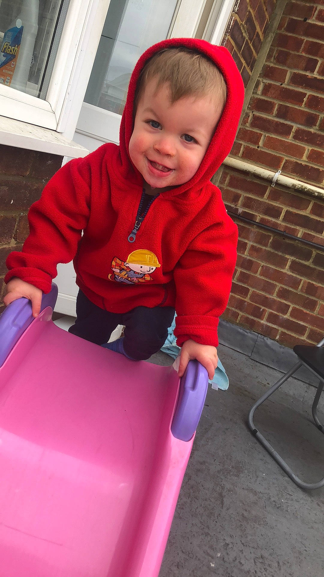 Ronnie joined the competition — help win amazing prizes! baby, baby_toddler_clothing, child, chute, city, electric_blue, fun, happy, joy, lap, leisure, magenta, person, play, recreation, red, riding_toy, sitting, sleeve, smile