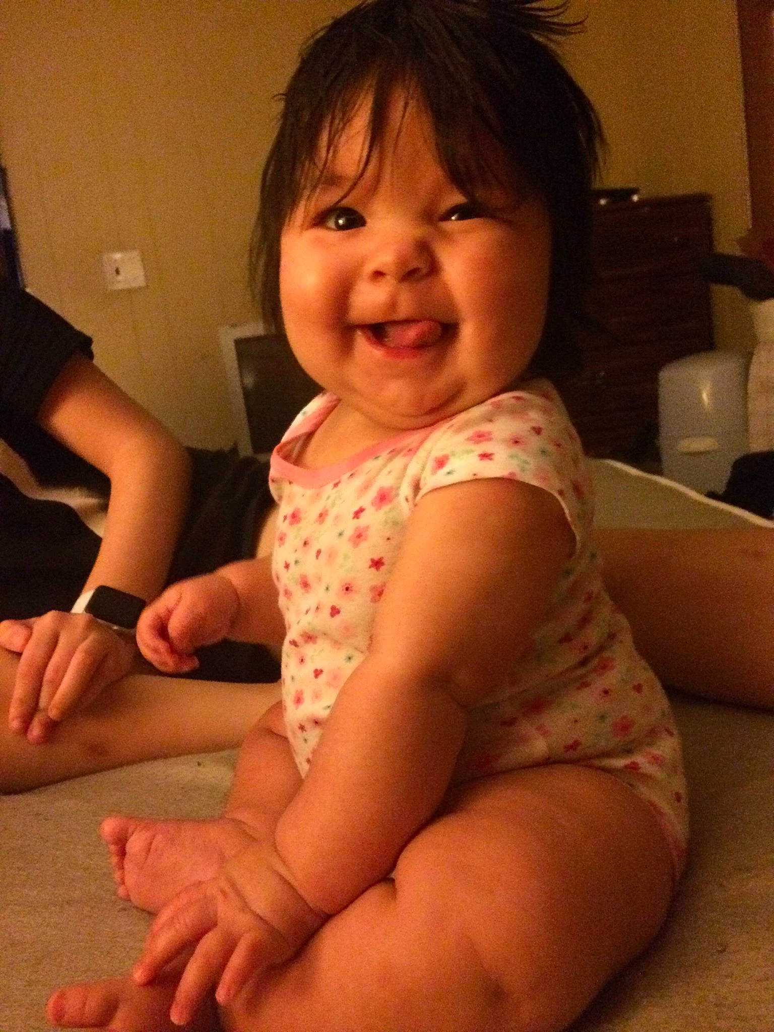 Scarlett is registered to the contest to win money with this photo: arm, baby, cheek, child, elbow, finger, leg, person, sitting, skin, smile, thumb, toddler