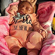 Lanell Davis joined the competition — help win amazing prizes! baby, newborn, sleeping, pacifier, bow, headband, blanket, pink, clothing, infant, cozy, cute, soft, resting, child, person, fabric, warm, indoors, portrait