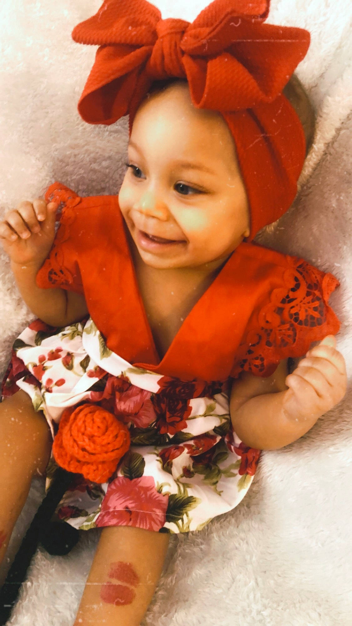 Bryleigh is registered to the contest to win money with this photo: arm, cap, child, eye, face, finger, flower, hairstyle, hand, happy, head, headgear, headwear, human, joy, lip, orange, person, petal, skin