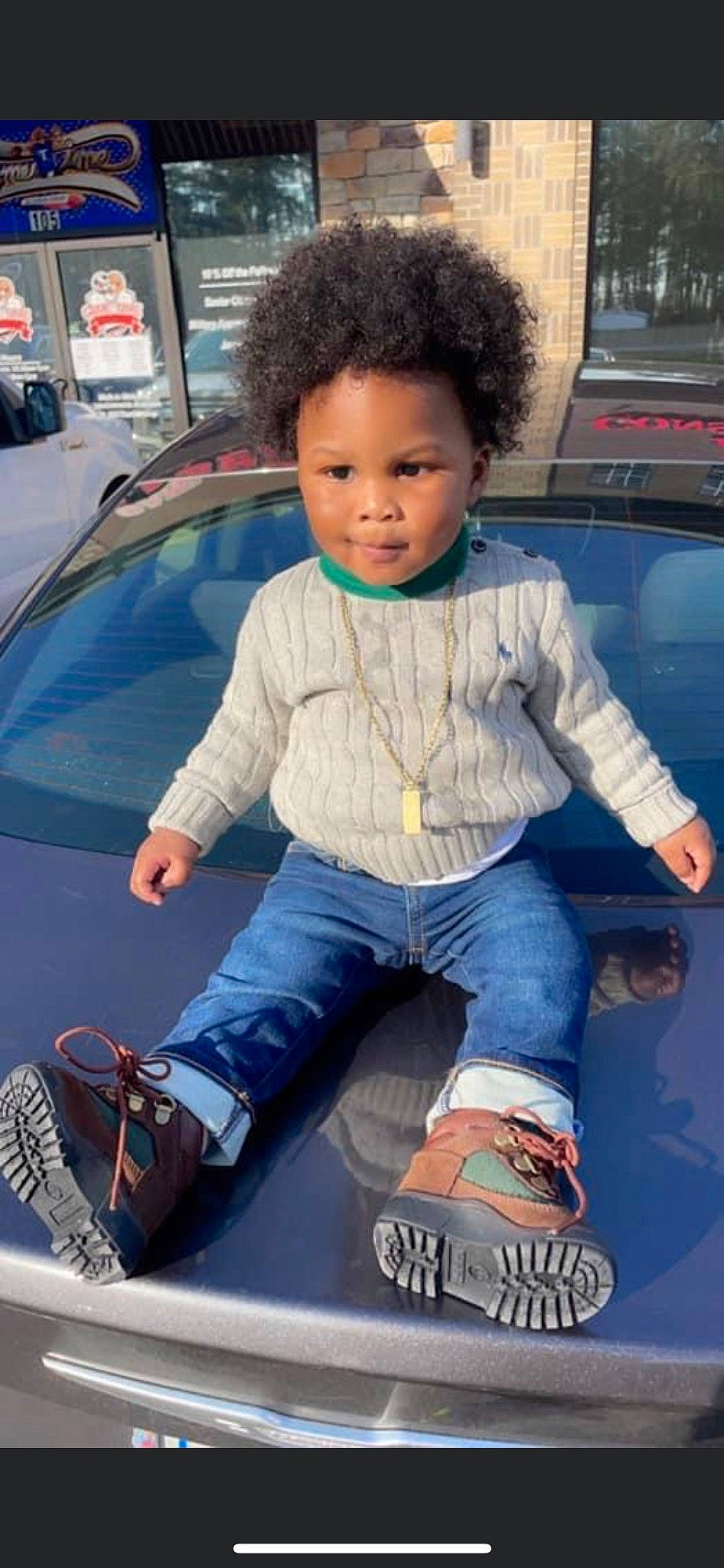 Nicholas Amir is registered to the contest to win money with this photo: automotive_design, automotive_exterior, bumper, car, cool, electric_blue, hairstyle, hood, leg, leisure, motor_vehicle, person, photograph, shoe, snapshot, sneakers, tints_and_shades, toddler, trunk, vehicle