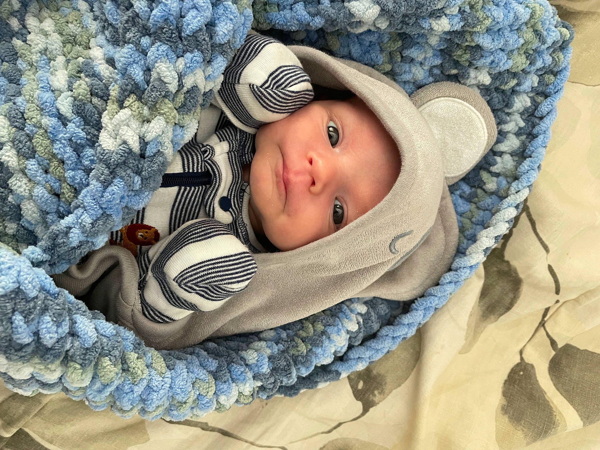 Gabriel is registered to the contest to win money with this photo: baby, baby_products, baby_safety, baby_sleeping, baby_toddler_clothing, beanie, cap, child, comfort, eye, fashion_accessory, hat, head, headgear, headwear, knit_cap, linens, pattern, person, sun_hat