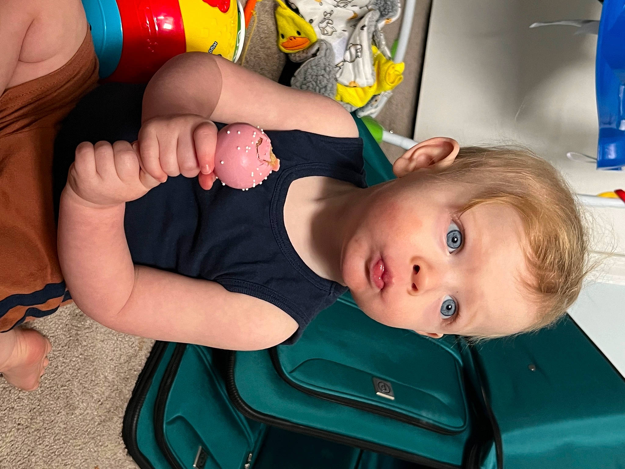 Mason is registered to the contest to win money with this photo: baby, baby_toddler_clothing, chair, child, comfort, elbow, eye, finger, fun, gesture, human_body, human_leg, joint, knee, mouth, person, shorts, sitting, skin, surprise