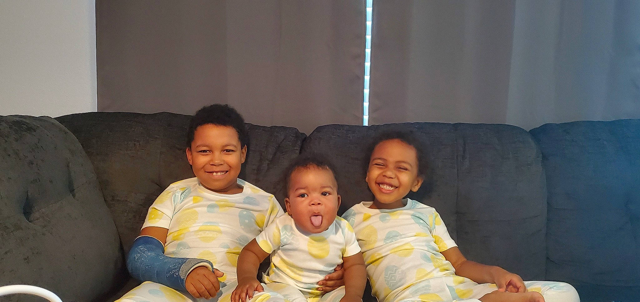 Marcel is registered to the contest to win money with this photo: baby_toddler_clothing, cheek, comfort, couch, face, fun, hair, hairstyle, happy, human_body, interaction, iris, joy, lap, living_room, person, sharing, skin, smile, standing