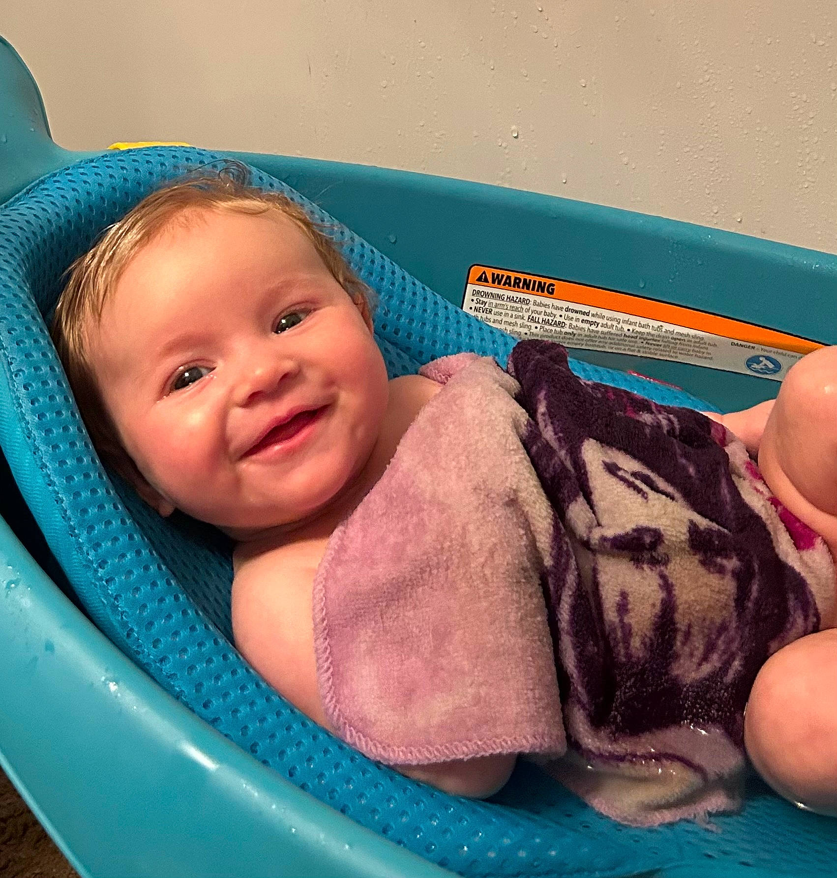 Tatum is registered to the contest to win money with this photo: baby, baby_bathing, baby_products, bathing, blue, cheek, chest, child, comfort, eye, fashion_accessory, finger, fun, hand, happy, joy, leisure, person, skin, smile