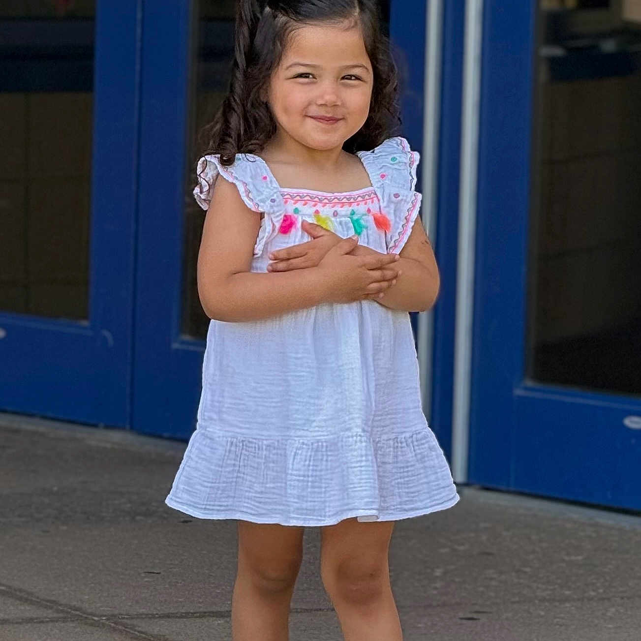 Janay is registered to the contest to win money with this photo: blue_door, casual, child, confident, curly_hair, cute, fashion, girl, happy, outdoor, person, playful, portrait, sandals, sidewalk, smile, standing, summer, white_dress, young
