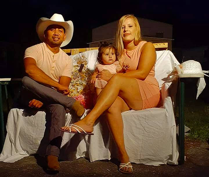 Karlee is registered to the contest to win money with this photo: event, family, fun, headwear, joy, lap, leg, leisure, performance, person, sitting, thigh, vacation