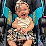baby, child, car_seat, plaid, headband, skirt, smile, happy, toenails, painted_nails, clothing, infant, seatbelt, indoor, person, young_child, cheerful, cute, fashion, sitting