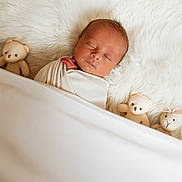 ézékiel a rejoint le concours — aidez-le/la à gagner de superbes lots ! newborn, baby, sleeping, swaddled, blanket, plush_toys, teddy_bear, fur, cozy, white, soft, peaceful, infant, cute, bedtime, portrait, child, resting, adorable, comfort