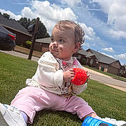 Victoria is registered to the contest to win money with this photo: toddler, child, grass, outdoor, sky, clouds, cup, cookie_container, oreo, sitting, face_paint, pink_pants, white_shoes, white_sweater, suburban, house, sidewalk, playful, messy, daytime