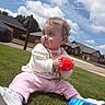 toddler, child, grass, outdoor, sky, clouds, cup, cookie_container, oreo, sitting, face_paint, pink_pants, white_shoes, white_sweater, suburban, house, sidewalk, playful, messy, daytime