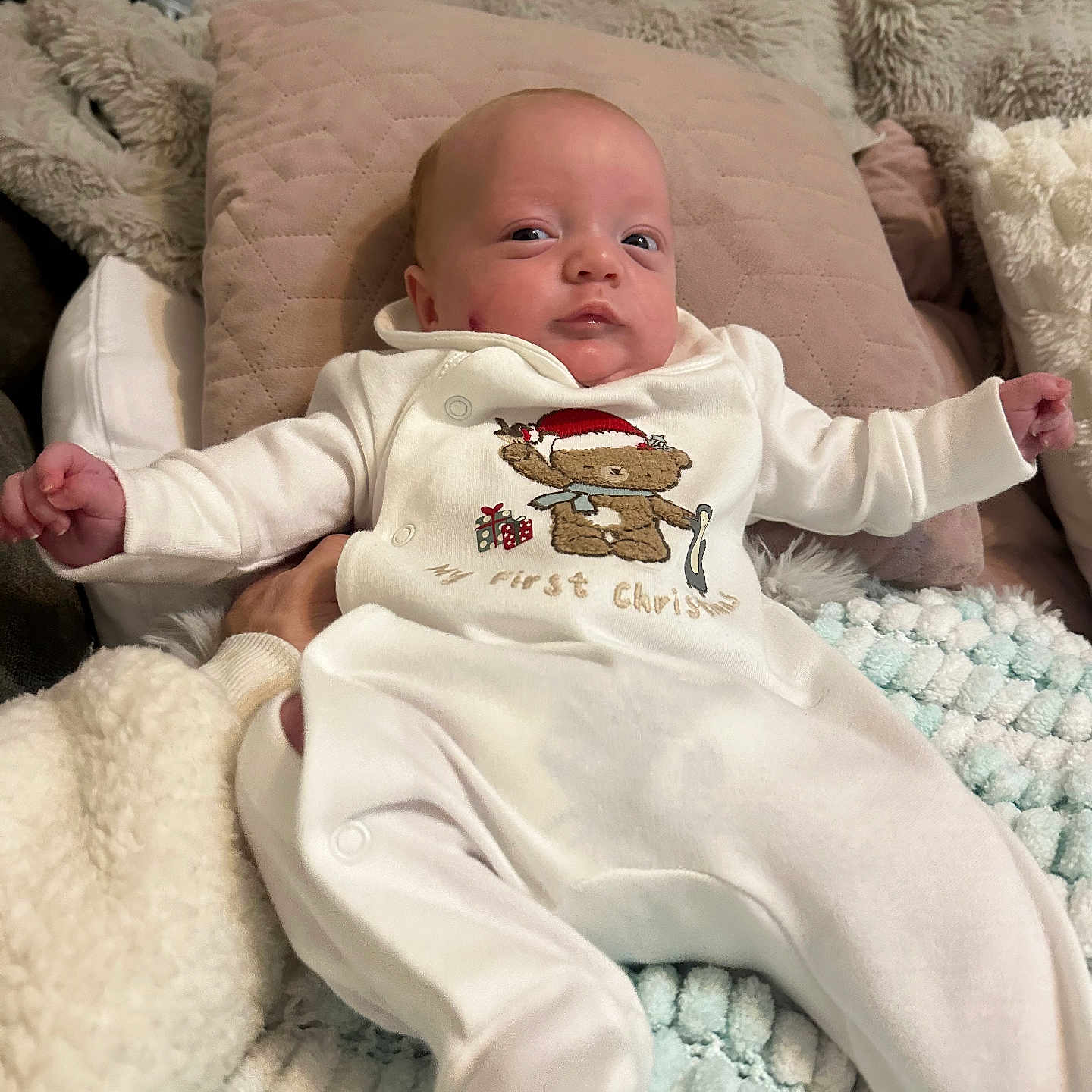 Ennis joined the competition — help win amazing prizes! baby, blanket, child, comfortable, cozy, cute, holiday_theme, indoor, infant, lying_down, newborn, onesie, person, pillow, plush, portrait, relaxed, soft_texture, teddy_bear, white_clothing